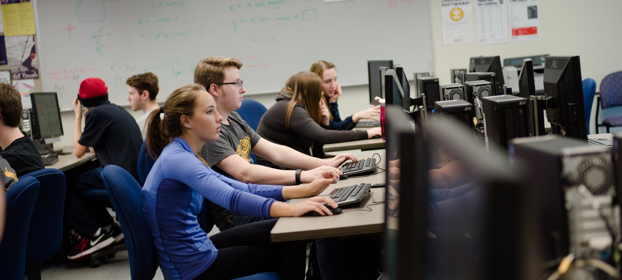 Students sitting at computers in a lab.