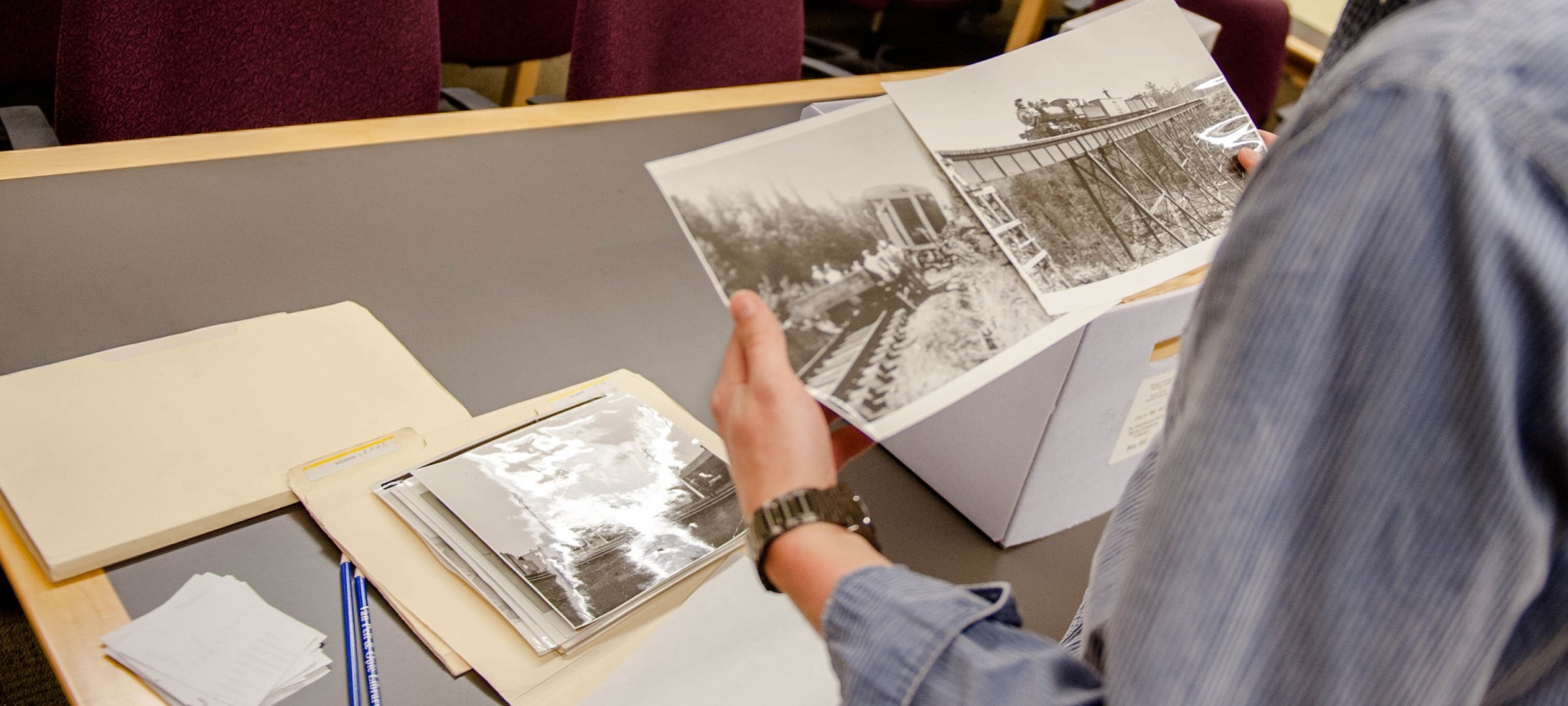 History student studying old newspapers.