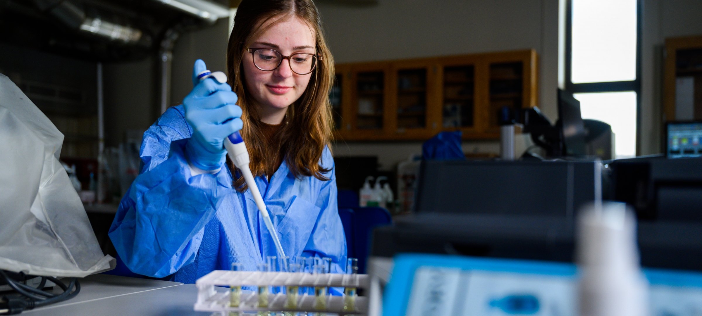 Medical laboratory science student working in a lab.