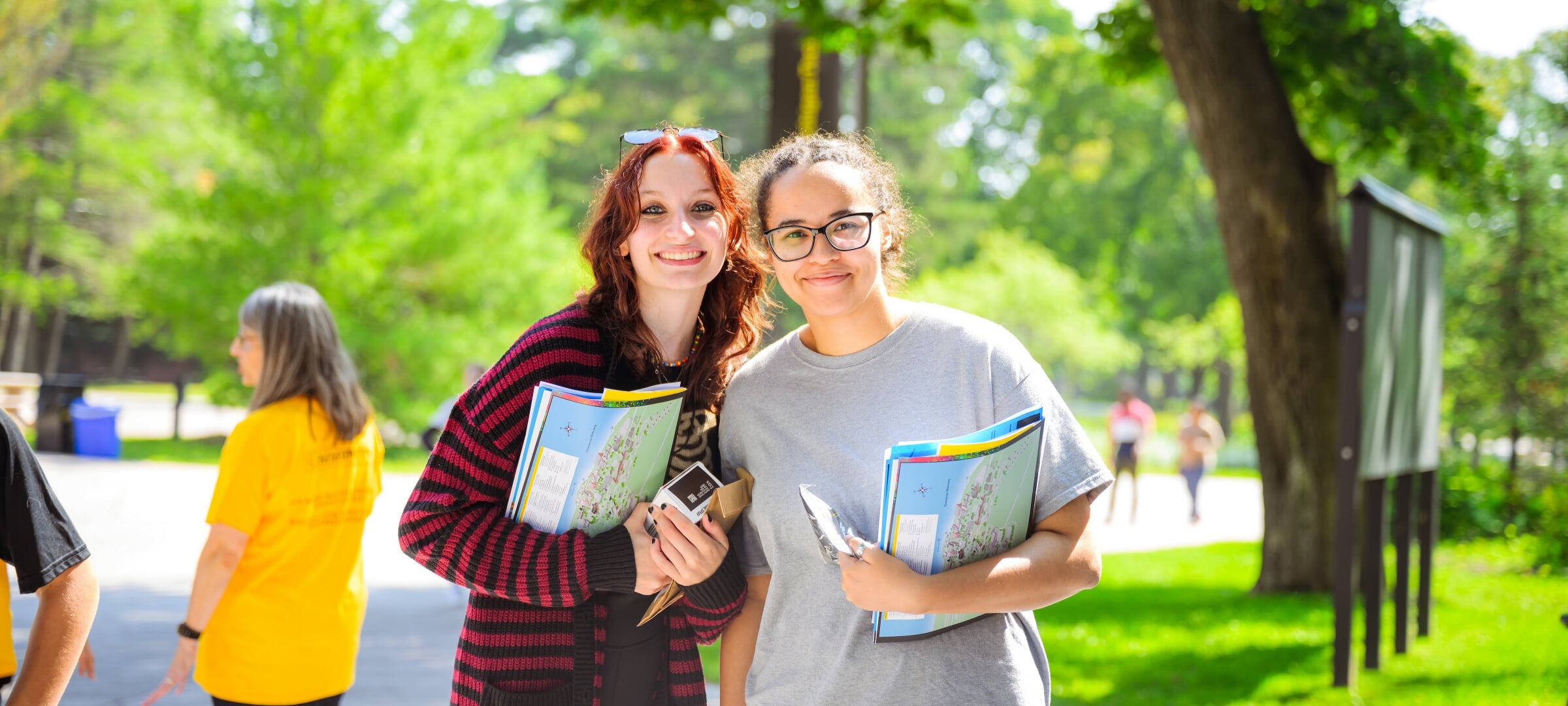 Students smiling on campus.