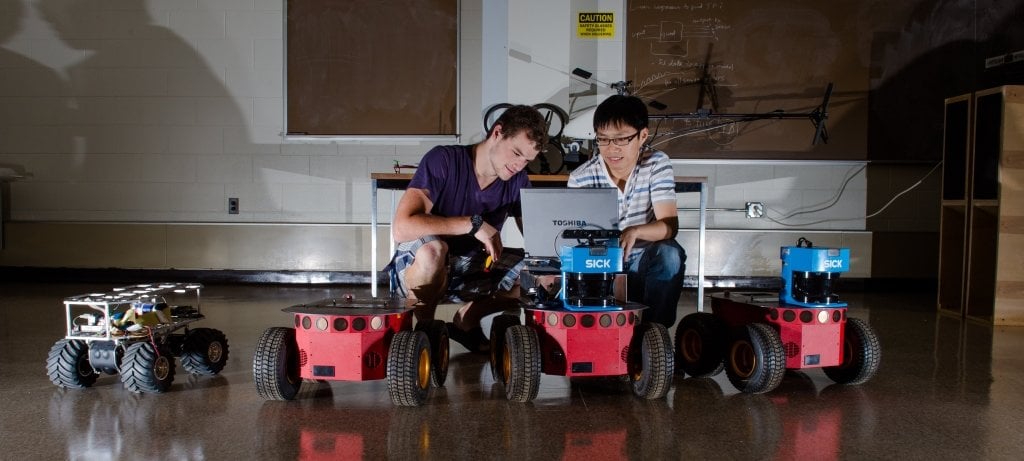 Students working with robotics