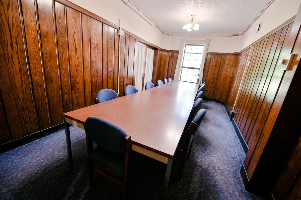 Conference Room with long table and chairs.