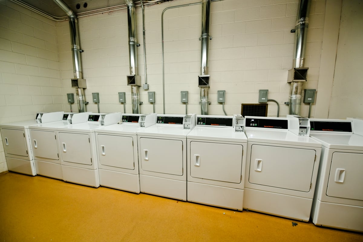Line of dryers along a wall.