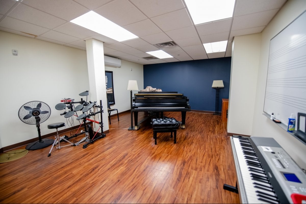 Music Room with drums, piano, and keyboard.