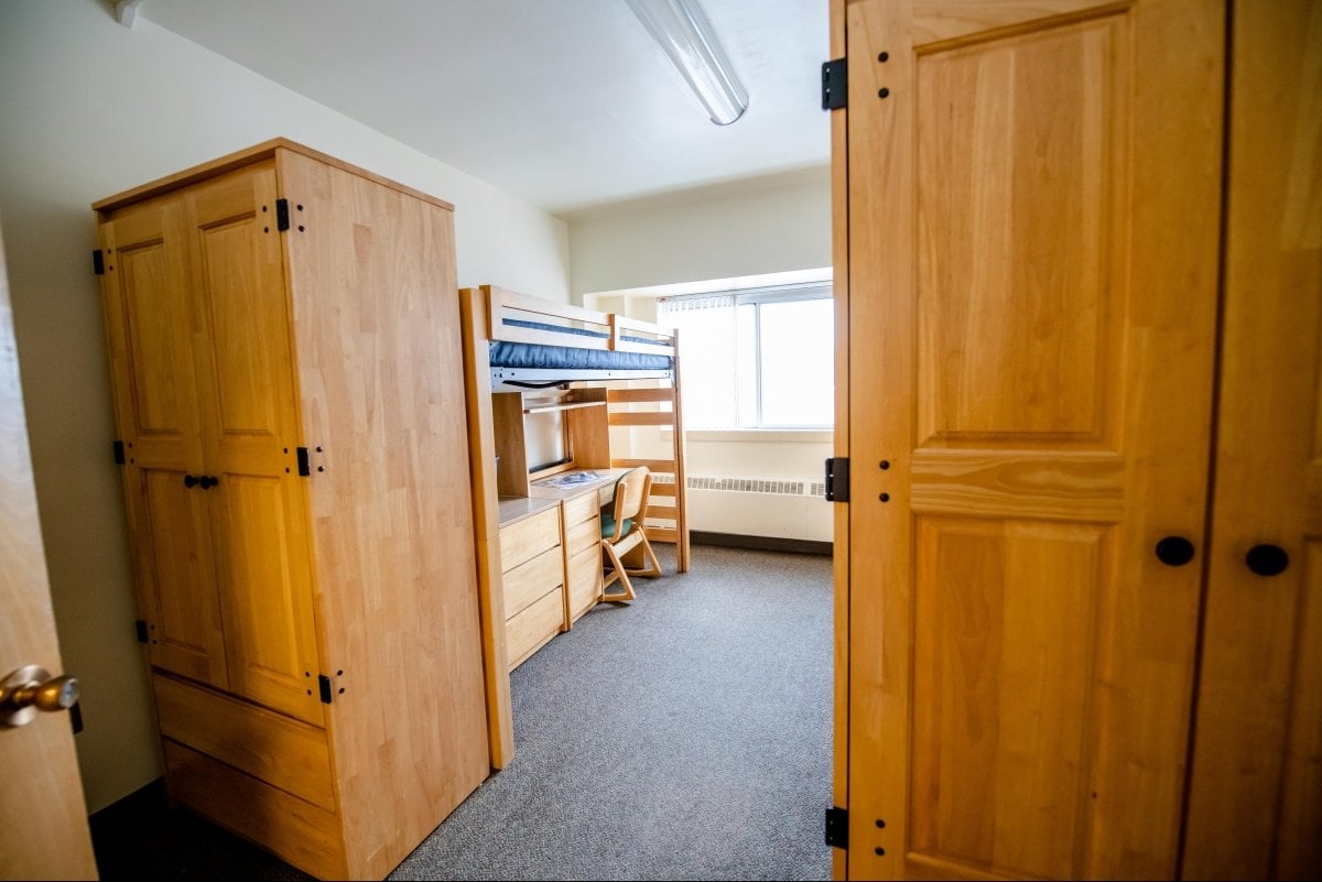 Wardrobes in front of loft beds.