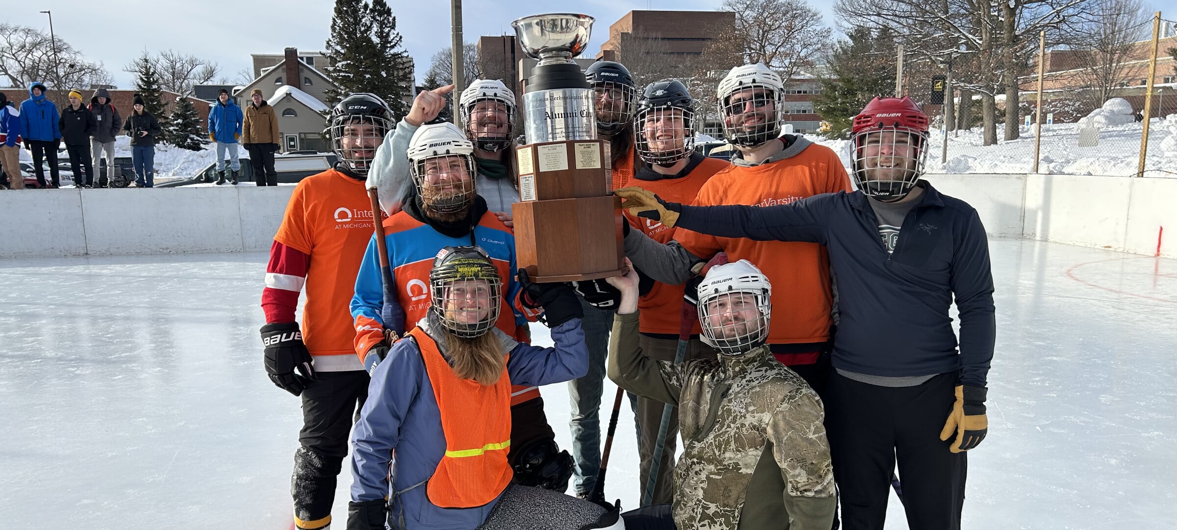 Group photo of winning alumni team at 2026 tournament.
