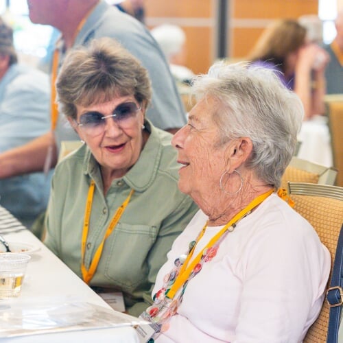 Two women talking and laughing