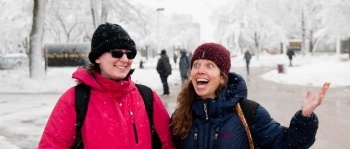 students outside on campus in the snow