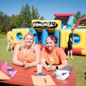 Two students sit at a table during K-Day