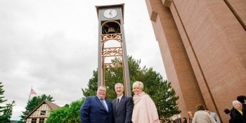 Bernard Family clock tower with William '69 and Ilene Bernard, Jr. and Dr. Richard Koubek