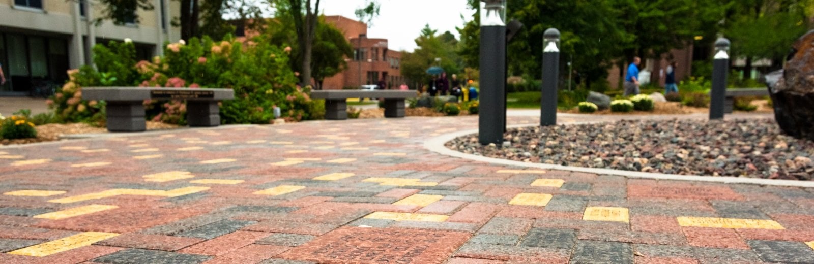 A view of the bricks and benches around the husky statue.