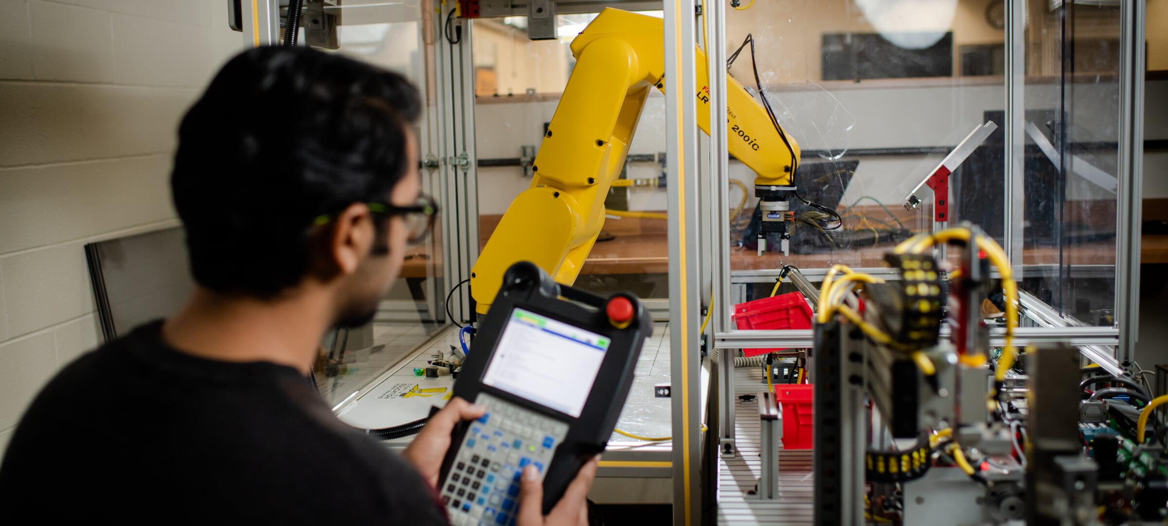 Student using robotics equipment in the lab.