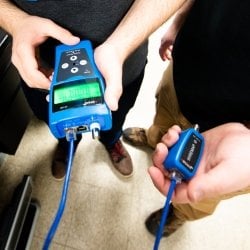 Students using a cable tester.