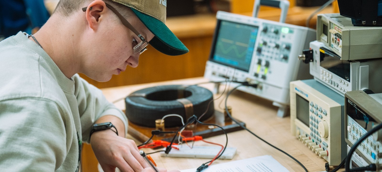 An Electrical Engineering Technology student works in the lab