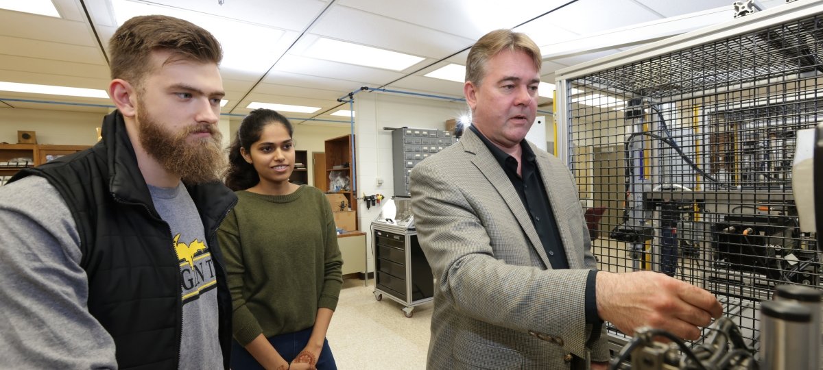 Prof. Alex Sergeyev, right, with Mechatronics students