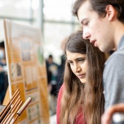 Particpants attending the Design Expo looking at a display