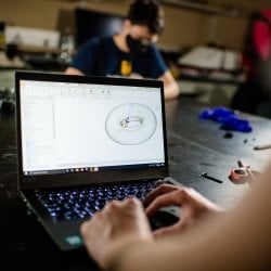 Close up picture of a laptop in a dark room