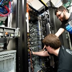 CNSA students working on a large computer