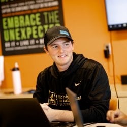 Student sitting at a table in the Pavlis Honors College