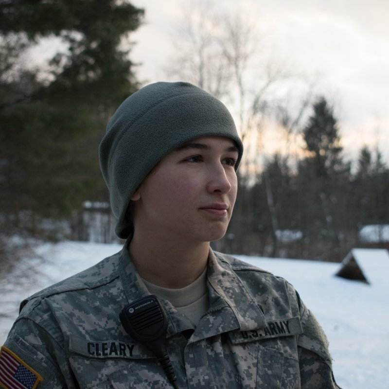 Platoon Sergeant in camo in the woods during winter