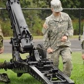 Cadet pullling cannon cord and kneeling