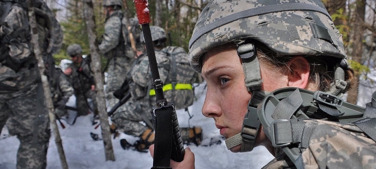 Cadets in the woods in winter, female cadet in the foreground