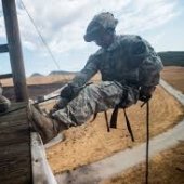 Cadet in a harness getting ready to drop from a tower