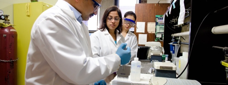 Dr. Ashutosh Tiwari with students in Chemistry lab