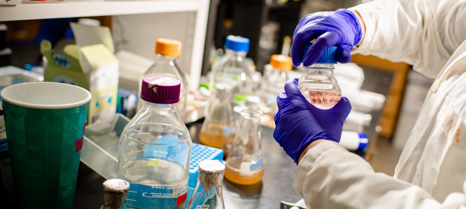 Student working with chemicals in a lab.