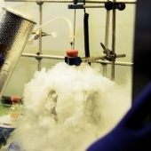 steam bubbling from an experiment under a ventilated hood in a lab