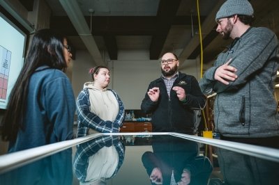 Students being taught at an interactive table