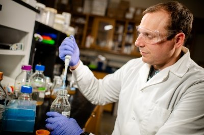 Steve using a pipette in the lab