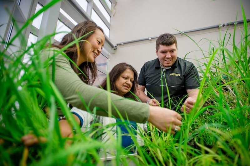 datta and students around grass