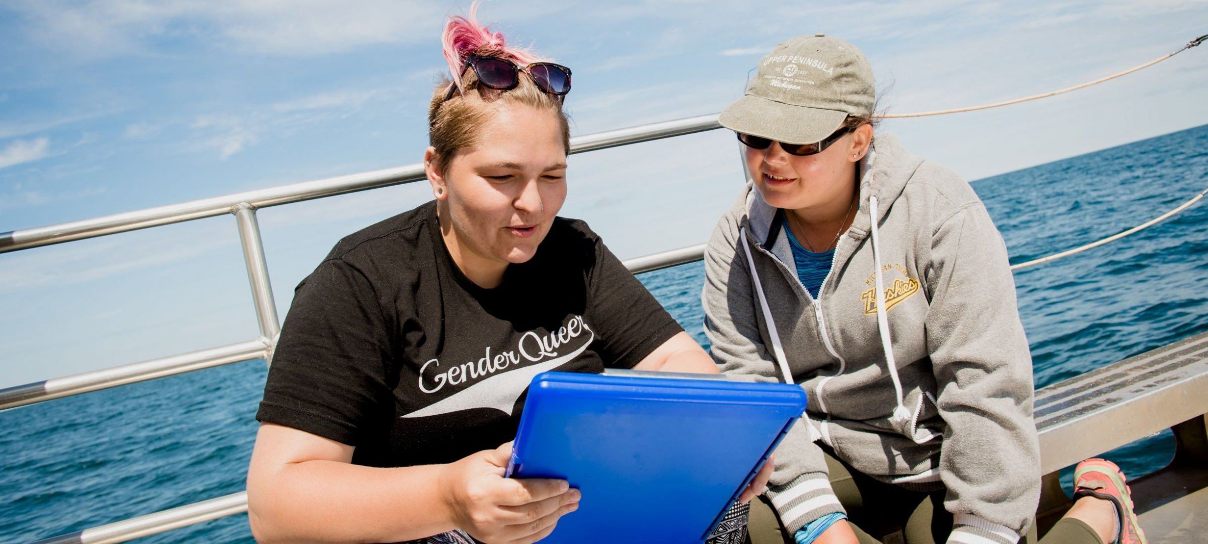 Students reviewing data aboard our boat, the Agassiz, on Lake Superior.