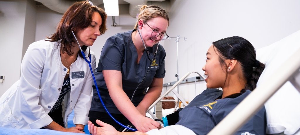 Nurse sets up IV bottle on a rack