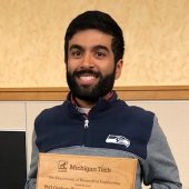 Ameya Narkar holding his award.