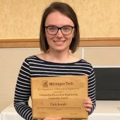 Carly Joseph holding her award.