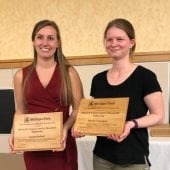 Cassidy Sheffield and Hannah Cunningham holding their awards.