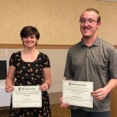 Jennie Baker and Sterling Korstad holding their award certificates.