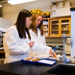 Yu and student in the Brain Stimulation Engineering Lab.