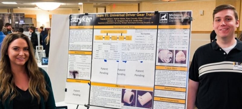 Students by Their Poster at Design Expo