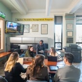 Students around a coffee table discussing