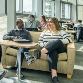 Business students sitting, talking.