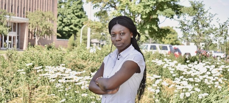 Graduate student Josephine Amponsem takes a research break outside.