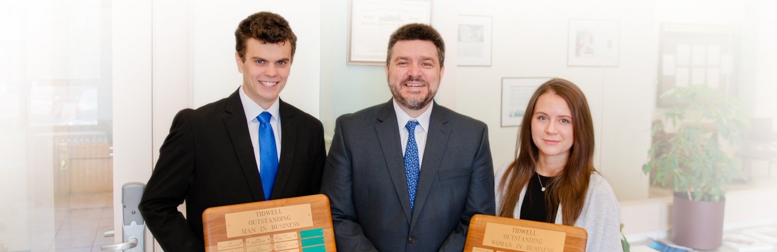 James Sturos and Hailey LaFleur receiving their awards from Dean Johnson.