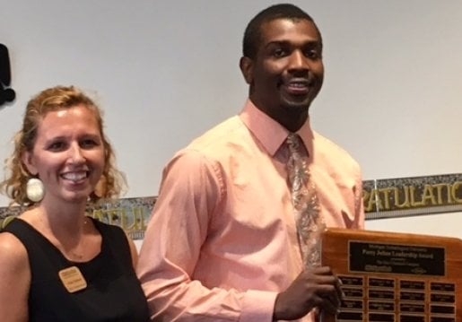 Kellie Raffaelli and Jimmie Cannon with his award.