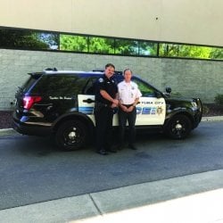 Richard Ten Haken with police officer and car