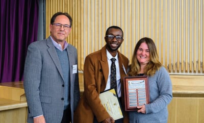 Derrick Ayisi standing between Kevin Wampler and Laura Sieders.
