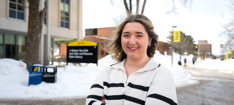 Ruby Walker standing outside on campus.