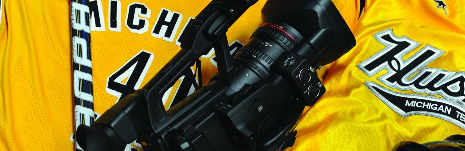 Michigan Tech jerseys with a camera.